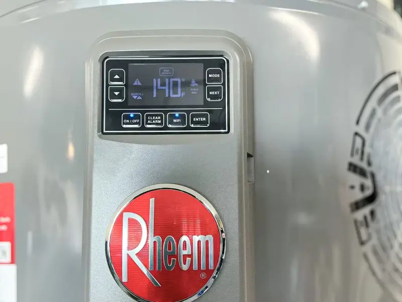 Rheem water heater with its digital control panel set to 140°F